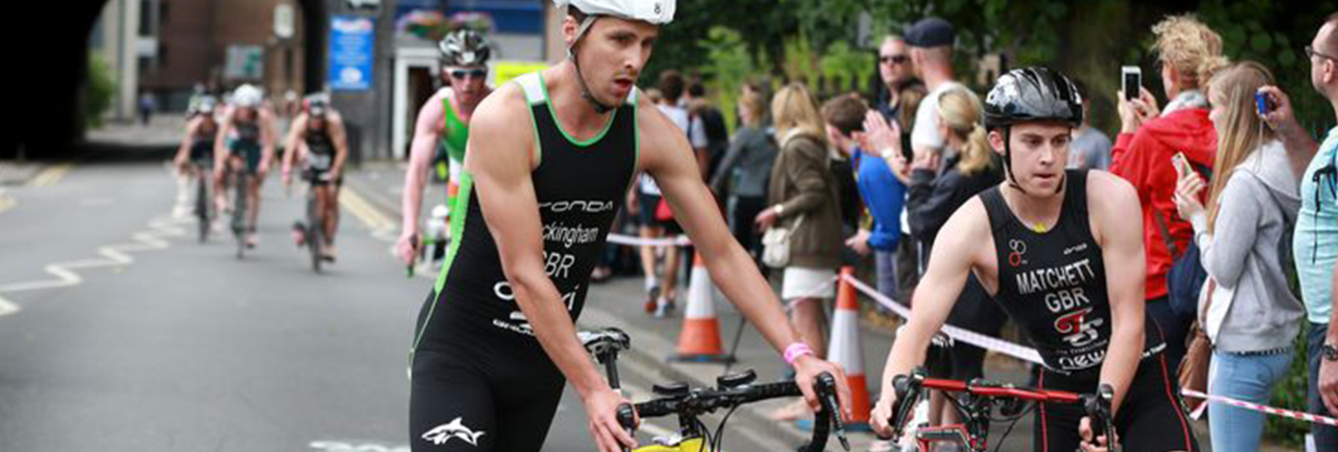 Two Cyclists taking part in a triathlon race