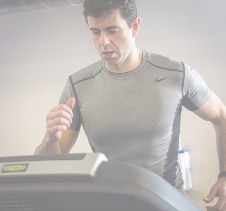 Athlete runner monitoring performance on a treadmill