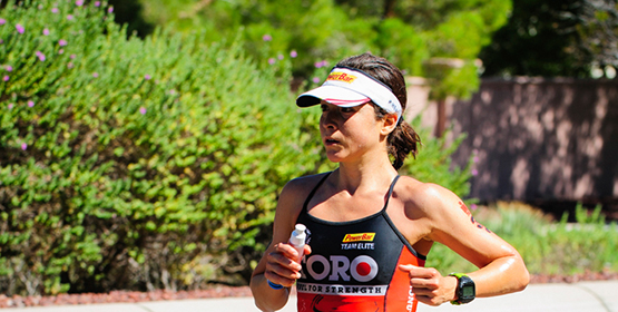 Female athlete runner running as part of a race